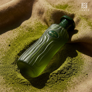 Matcha perfume bottle on green tea powder